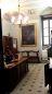 L'attuale ingresso della biblioteca con il ritratto del cardinale Casanate